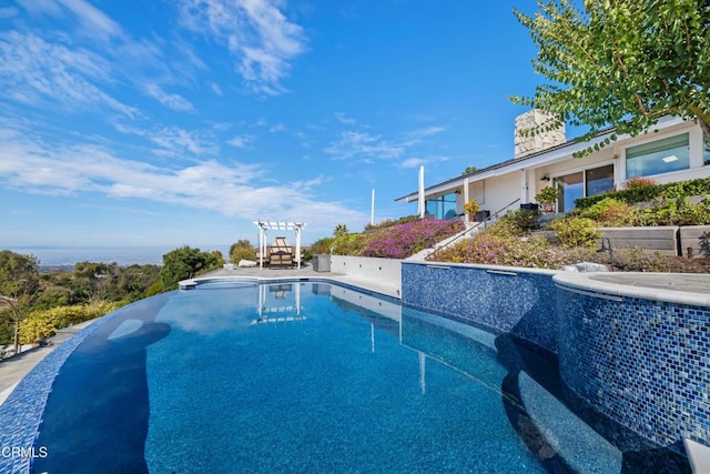 view of swimming pool with an infinity pool, central AC, a patio, and a hot tub