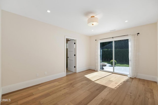 unfurnished room featuring baseboards, recessed lighting, and light wood-style floors