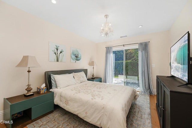 bedroom featuring a notable chandelier, recessed lighting, wood finished floors, visible vents, and access to exterior