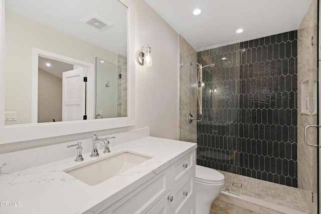 full bath featuring toilet, recessed lighting, visible vents, vanity, and a shower stall