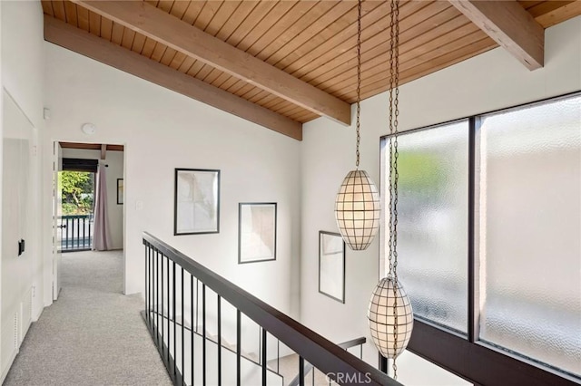 115 Bayside Pl Unit 115, Corona Del Mar, CA 92625 - hall with vaulted ceiling with beams, wooden ceiling, and light colored carpet