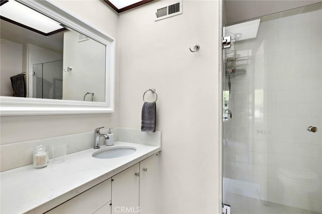 115 Bayside Pl Unit 115, Corona Del Mar, CA 92625 - full bathroom featuring vanity, visible vents, and a shower stall