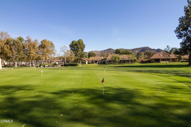 view of home's community featuring a residential view, a mountain view, and golf course view