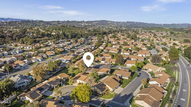 birds eye view of property with a residential view and a mountain view