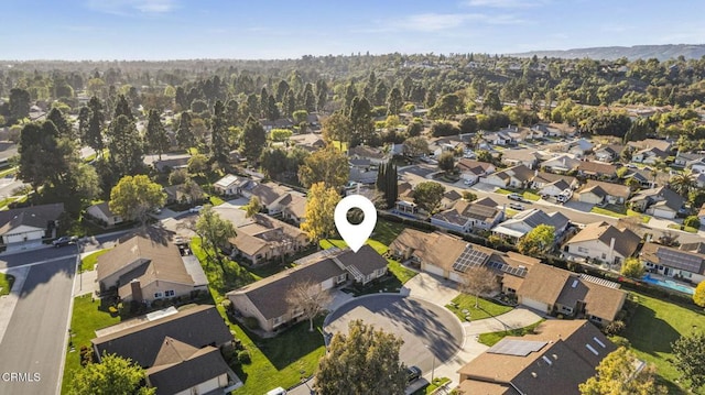 birds eye view of property with a residential view