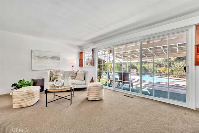 carpeted living room with visible vents