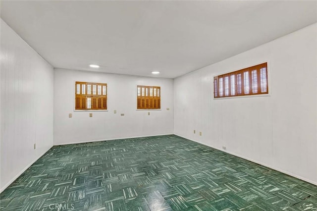 below grade area featuring parquet flooring