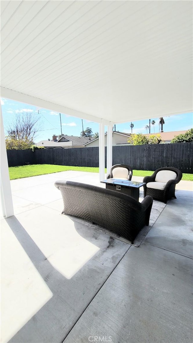 view of patio featuring a fenced backyard and outdoor lounge area