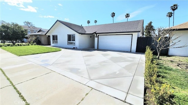 ranch-style home with a garage, driveway, a front lawn, and stucco siding