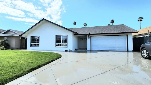 single story home featuring an attached garage, fence, concrete driveway, stucco siding, and a front yard