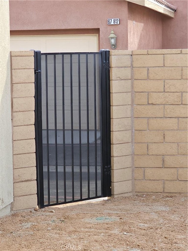 view of gate featuring fence