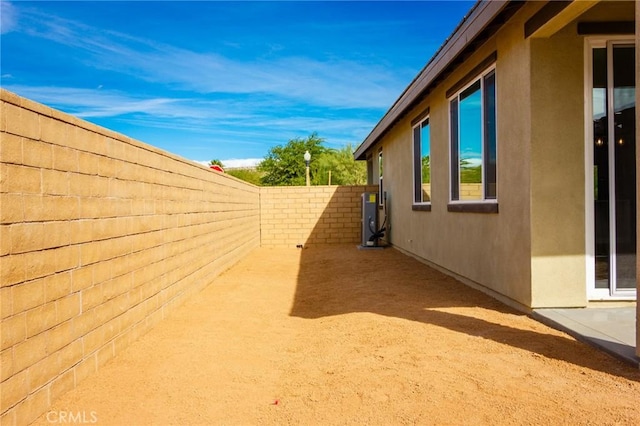 view of home's exterior featuring a fenced backyard and stucco siding