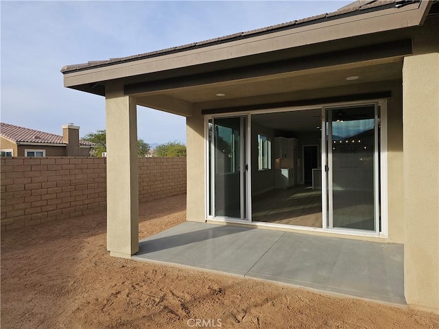 view of patio / terrace featuring fence