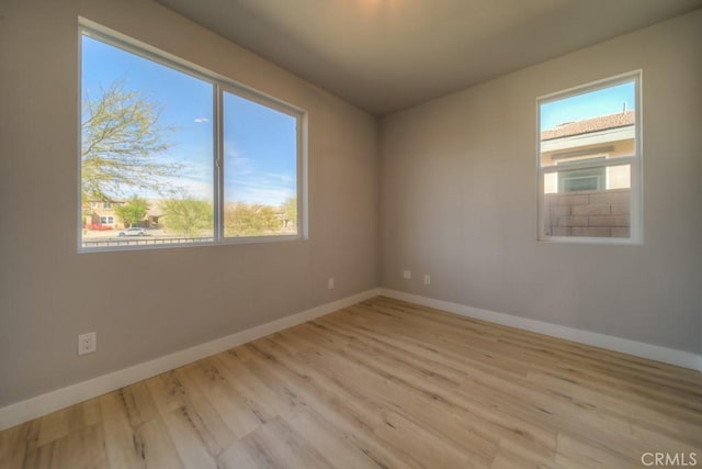 67813 Rio Vista Dr, Cathedral City, CA 92234 - unfurnished room with baseboards and light wood-style floors