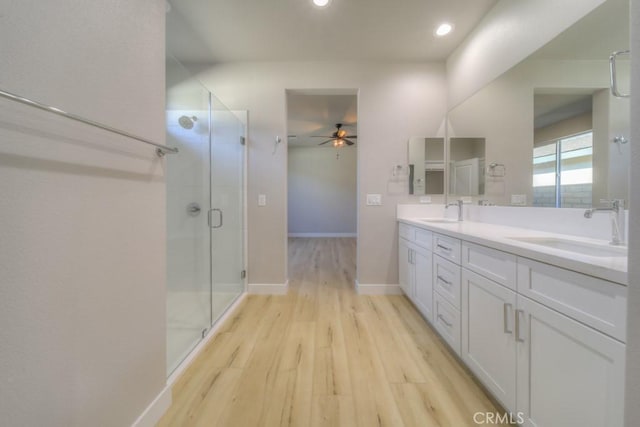 67813 Rio Vista Dr, Cathedral City, CA 92234 - full bath with wood finished floors, double vanity, a stall shower, ceiling fan, and recessed lighting