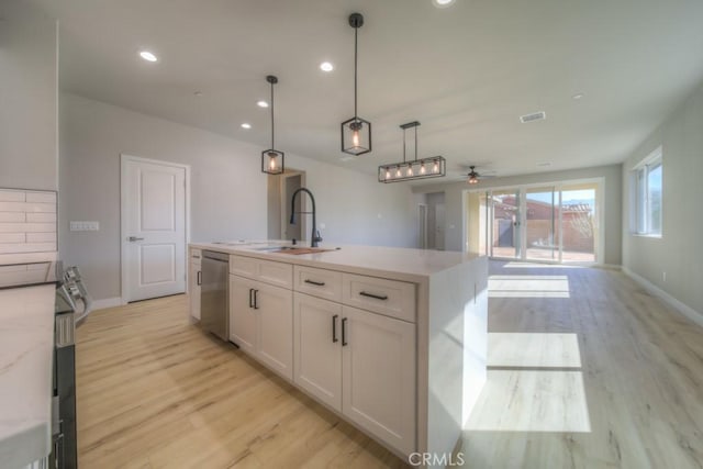 67813 Rio Vista Dr, Cathedral City, CA 92234 - kitchen featuring appliances with stainless steel finishes, a ceiling fan, light wood-style flooring, recessed lighting, and pendant lighting