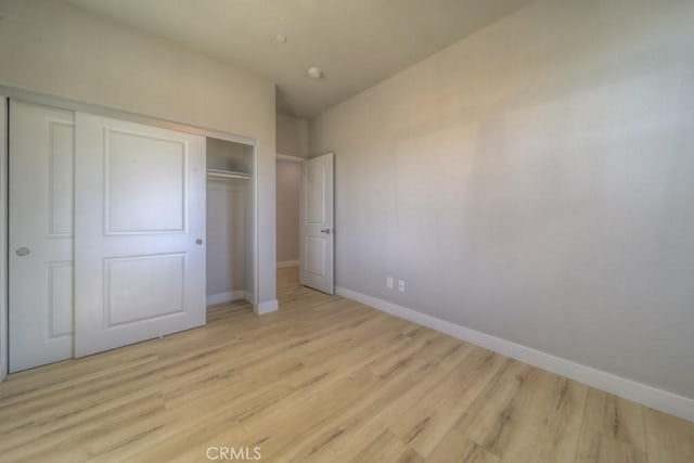 67813 Rio Vista Dr, Cathedral City, CA 92234 - unfurnished bedroom featuring a closet and light wood finished floors