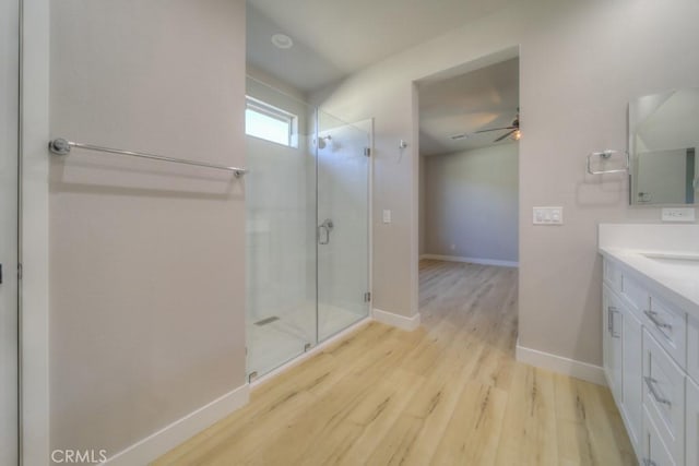 67813 Rio Vista Dr, Cathedral City, CA 92234 - full bath featuring vanity, a shower stall, wood finished floors, and a ceiling fan