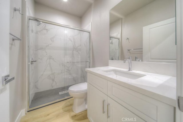 67813 Rio Vista Dr, Cathedral City, CA 92234 - full bath with a marble finish shower, wood finished floors, and vanity