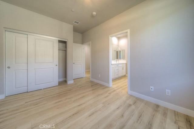 67813 Rio Vista Dr, Cathedral City, CA 92234 - unfurnished bedroom with a closet and light wood-style flooring