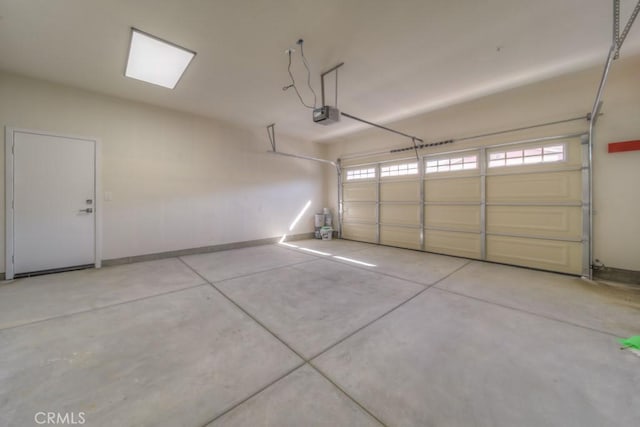 67813 Rio Vista Dr, Cathedral City, CA 92234 - garage with a garage door opener and baseboards