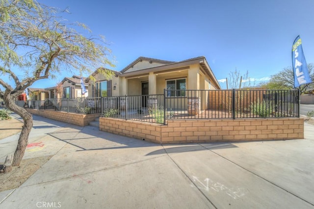 67813 Rio Vista Dr, Cathedral City, CA 92234 - view of front of house featuring a fenced front yard and stucco siding