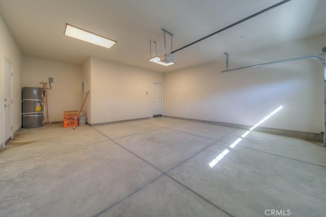 67813 Rio Vista Dr, Cathedral City, CA 92234 - garage with water heater and a garage door opener