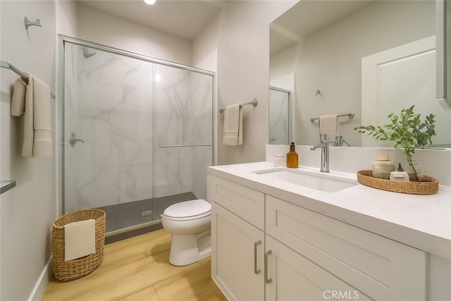 67813 Rio Vista Dr, Cathedral City, CA 92234 - bathroom with vanity, a marble finish shower, and wood finished floors