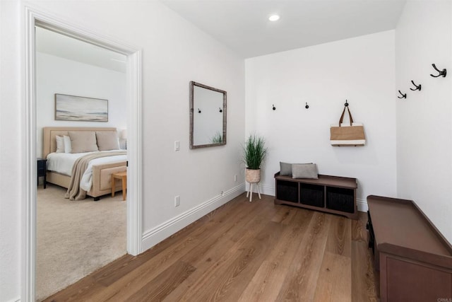 interior space with light wood-style flooring, baseboards, and recessed lighting