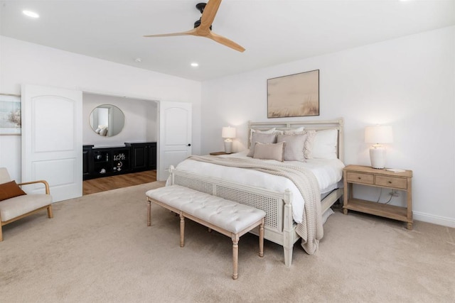 bedroom featuring recessed lighting, baseboards, a ceiling fan, and light colored carpet