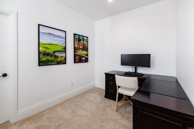 office area featuring light colored carpet and baseboards