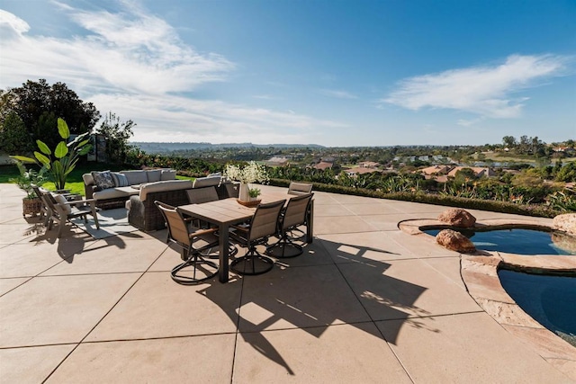 view of patio with outdoor dining space, an outdoor pool, and an outdoor living space