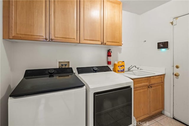 23718 Hathaway Dr, Valencia, CA 91354 - washroom with washing machine and dryer, light tile patterned flooring, and cabinet space