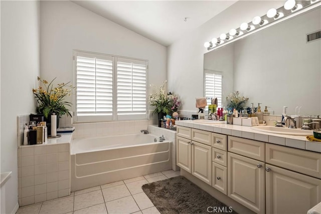 23718 Hathaway Dr, Valencia, CA 91354 - bathroom featuring tile patterned flooring, lofted ceiling, double vanity, and a bath