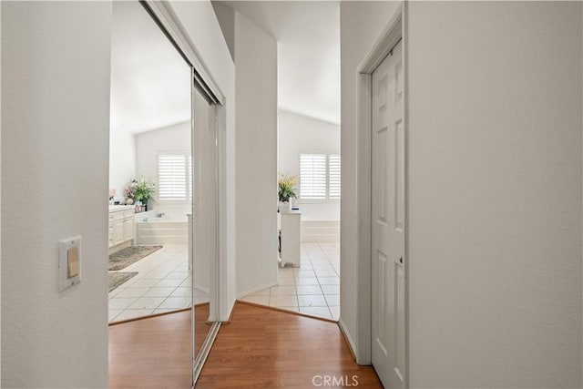 23718 Hathaway Dr, Valencia, CA 91354 - hallway with plenty of natural light and light tile patterned floors