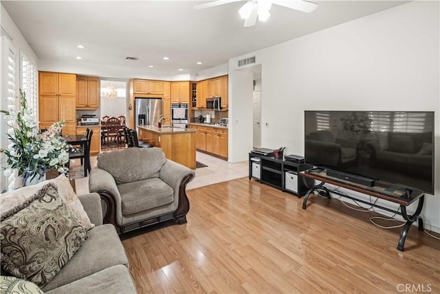 23718 Hathaway Dr, Valencia, CA 91354 - living area featuring light wood-style floors, ceiling fan, recessed lighting, and a chandelier