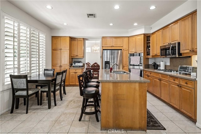 23718 Hathaway Dr, Valencia, CA 91354 - kitchen featuring appliances with stainless steel finishes, a sink, plenty of natural light, light tile patterned floors, and recessed lighting