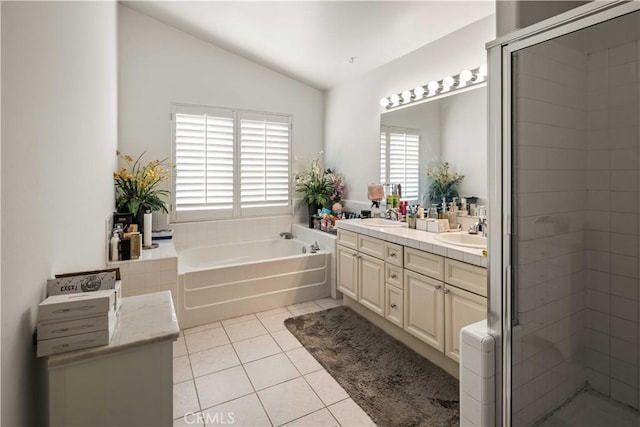 23718 Hathaway Dr, Valencia, CA 91354 - full bath featuring vaulted ceiling, double vanity, tile patterned flooring, a bath, and a shower stall