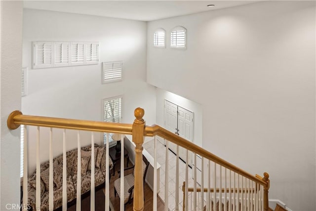 23718 Hathaway Dr, Valencia, CA 91354 - stairway with wood finished floors and a towering ceiling