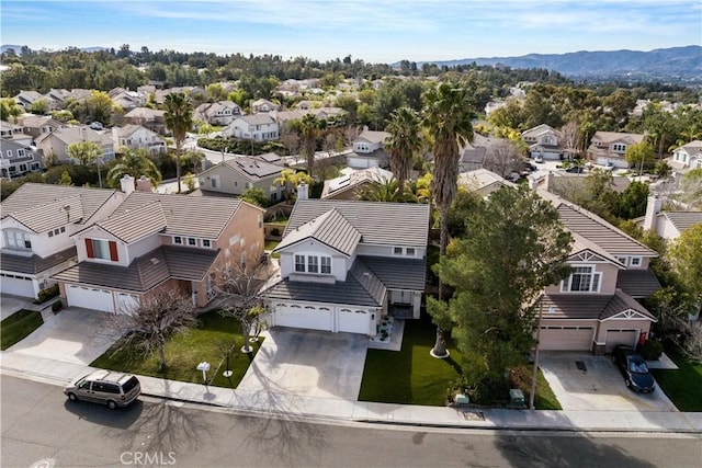 drone / aerial view with a residential view and a mountain view