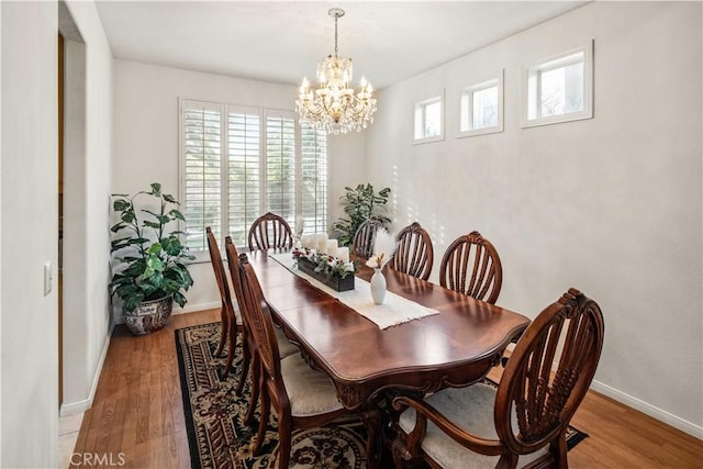 23718 Hathaway Dr, Valencia, CA 91354 - dining space with a chandelier, light wood-type flooring, and baseboards