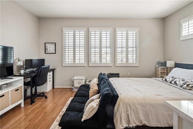 23718 Hathaway Dr, Valencia, CA 91354 - bedroom with light wood-style floors and an office area