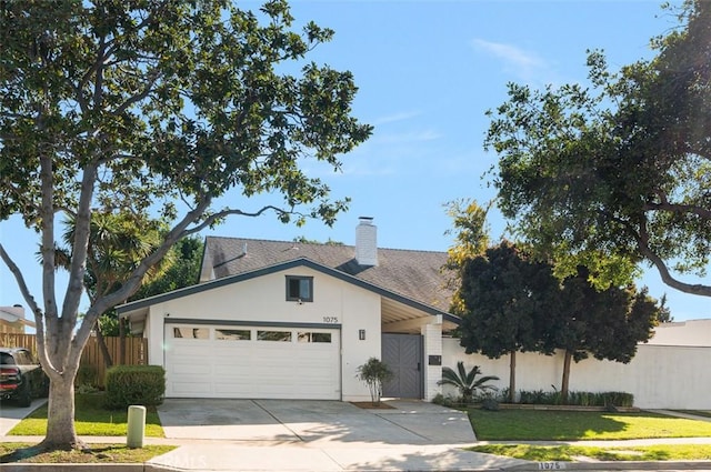 view of front of house featuring a garage, fence, concrete driveway, stucco siding, and a chimney