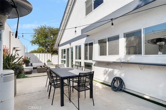 view of patio / terrace featuring outdoor dining area, a fenced backyard, and an outdoor hangout area