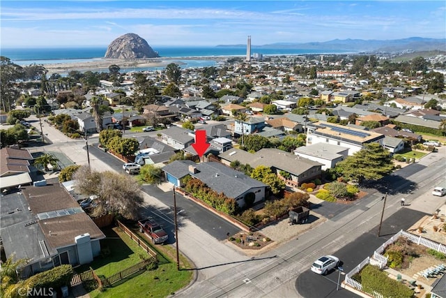 bird's eye view featuring a residential view and a water and mountain view