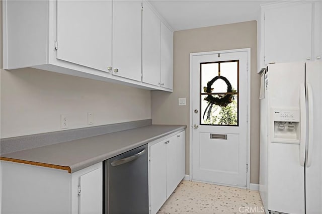 kitchen with light countertops, white refrigerator with ice dispenser, white cabinetry, and dishwasher