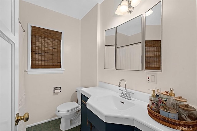 full bathroom featuring toilet, baseboards, and vanity