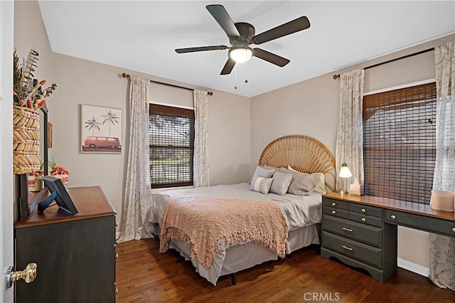 bedroom featuring dark wood-style flooring and ceiling fan