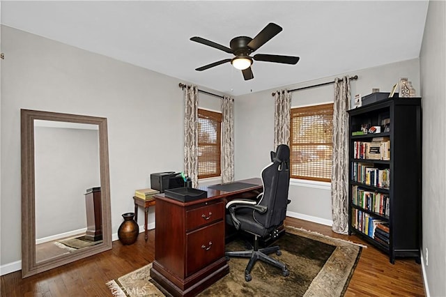 office area featuring ceiling fan, wood finished floors, and baseboards