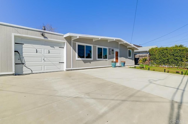 view of front of house featuring an attached garage and concrete driveway